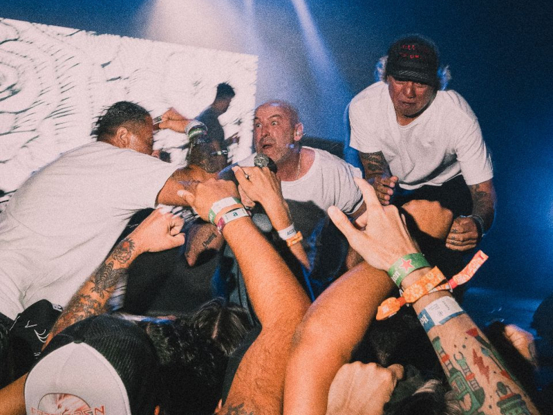 A press photo of the band CEREMONY playing live.